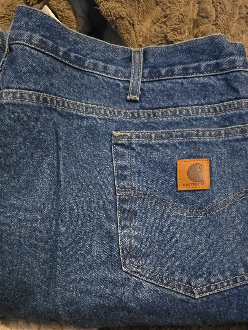 Carhartt Dark Blue Denim Jeans with Tan Leather Patch